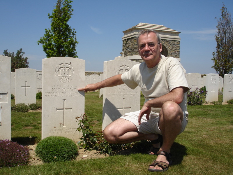 Rob Kent beside the grave of Herbert Potier